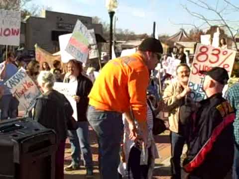 A local Union member and Marine square off over healthcare at a pro-Obamacare rally outside Shawnee City Hall in Shawnee, KS (suburban Kansas City) on Saturday, November 7th, organized by Kansas Democrats and MoveOn.org to oppose a healthcare amendment to the Kansas Constitution introduced by State Sen. Mary Pilcher Cook.