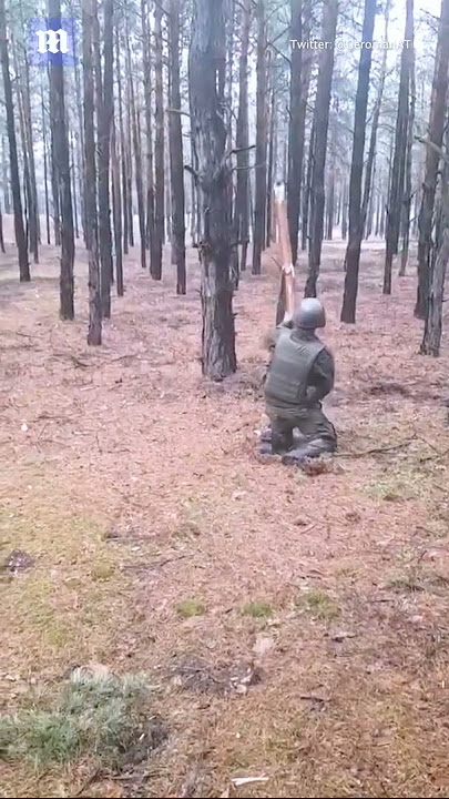 Russian soldier hits mine with stick and nearly gets his head blown off