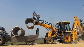 JCB Backhoe 3DX Unloading Heavy Culvert Pipe From Tractor