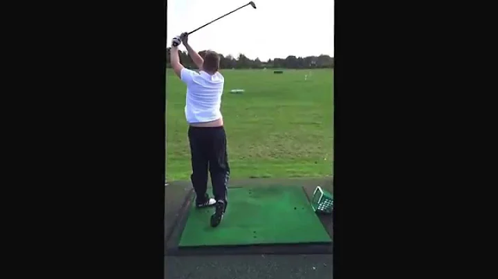 Me hitting a few balls after my first ever golf le...