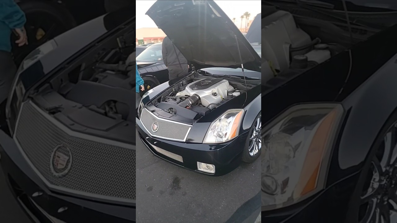 Taking a peak under the hood of a cadillac xlr v .. kinda cool , kinda plasticky