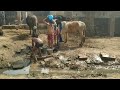 Children are taking bath in front of my home