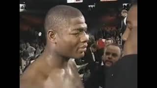 Riddick Bowe exchanges words with Lennox Lewis