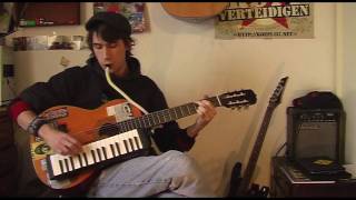 Playing guitar and melodica at the same time (introducing the melogitar)