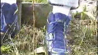 Guy stomping Flowers in his sneaker