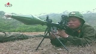 State TV shows North Korean soldiers shooting at a paper ... screenshot 5