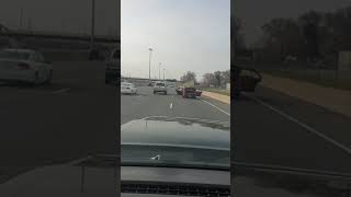 Person Driving Red Car Rides Down Highway with Both Car Doors Open - 1041228
