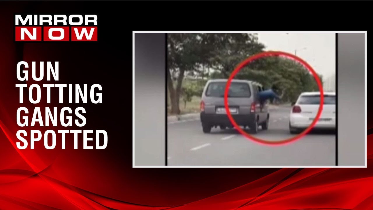 SHOCKING! Guns totting gang spotted; goons brandish guns in a moving car delhi news today fire