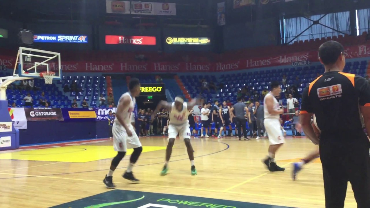 EAC's Sidney Onwubere drains a trey over Adamson's Simon Camacho