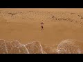 Woman on the beach in kauai hawaii  aerial cinematography