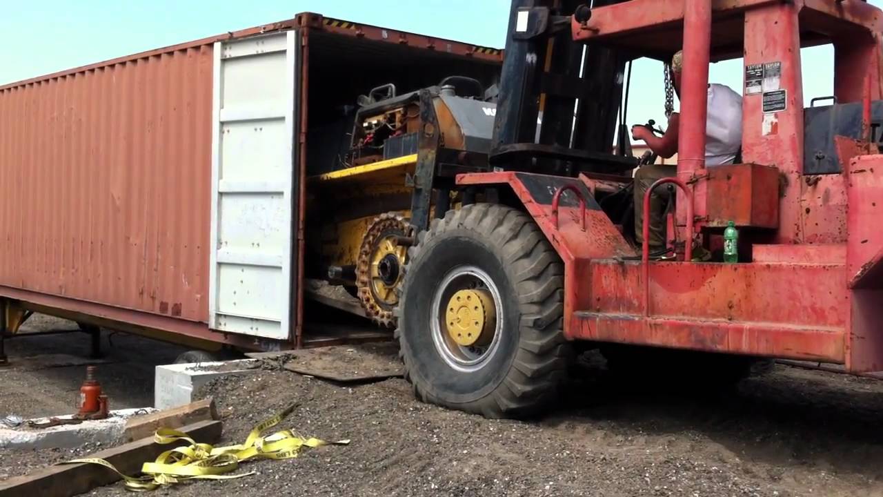 Dismantled Komatsu D65 Dozer loaded into 40 Container.MOV YouTube