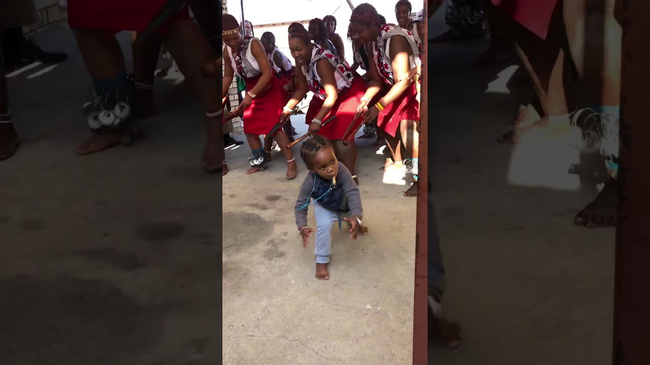 A 2 year old Siyabonga leading Sangoma initiates with such power  pride