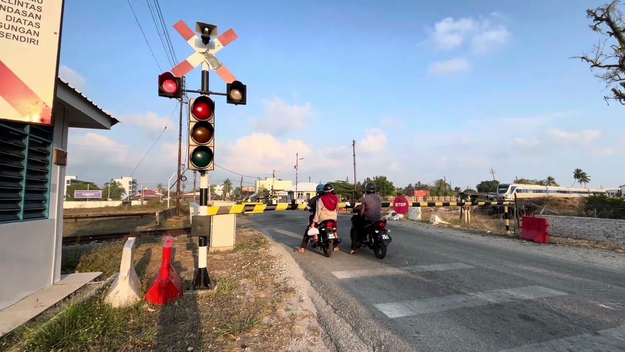 Railway crossing near train station in Malaysia