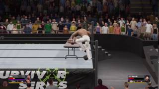 Seth Rollins Pheonix Splash Through Table to Bushwhacker Luke