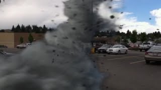 Tornado passing through WalMart Parking lot