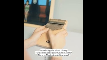 Experience the enchanting melodies with this beautifully crafted kalimba thumb piano.