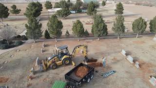 Cemetery Crew Hard At Work Digging Grave