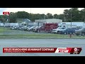 Police at home in connection with KC manhunt