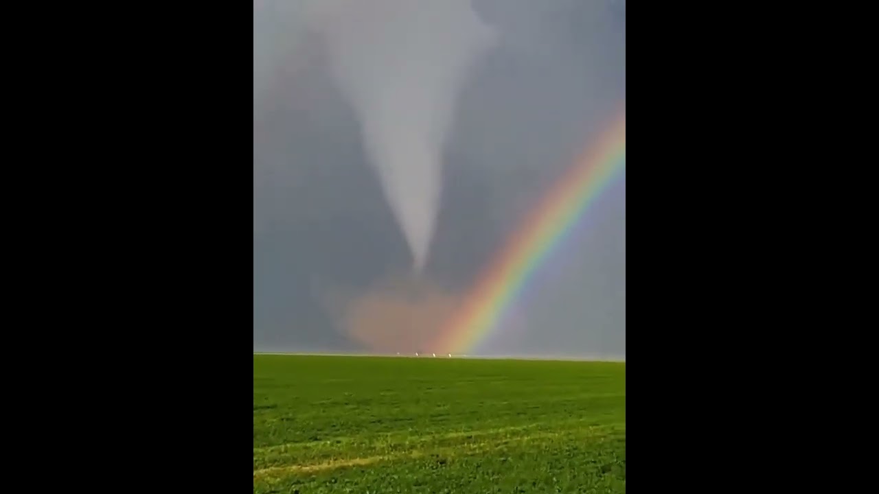 Nature's Dichotomy: The Dual Majesty of a Double Rainbow and Tornado Unleashed