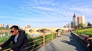 Cycling on Embankment Road at Beijing Grand Canal Forest Park