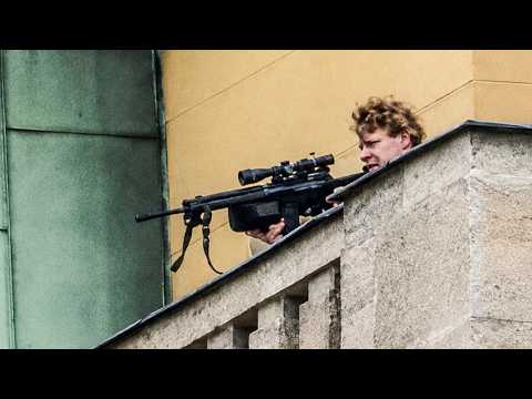 Gunman Opens Fire From Rooftop as Police Close In