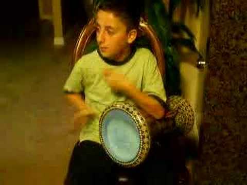 little boy going crazy on drum