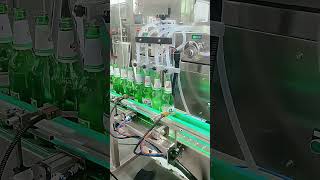 4 Head Beer Bottle Filling Machine| Automatic Beverage Filling Process#fillingmachine#liquidfilling