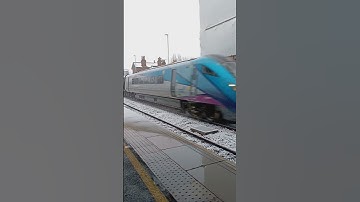 class 802 passing Garforth, picking up a lot of snow!