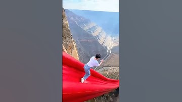 Is this slide to HELL?! 🔥⛰️ Did they survive? #CliffDrop #SkySlide