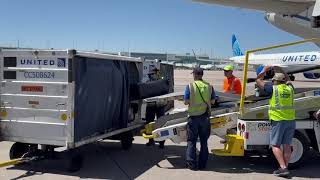 Power Stow Tail Loader in use at Denver International Airport.