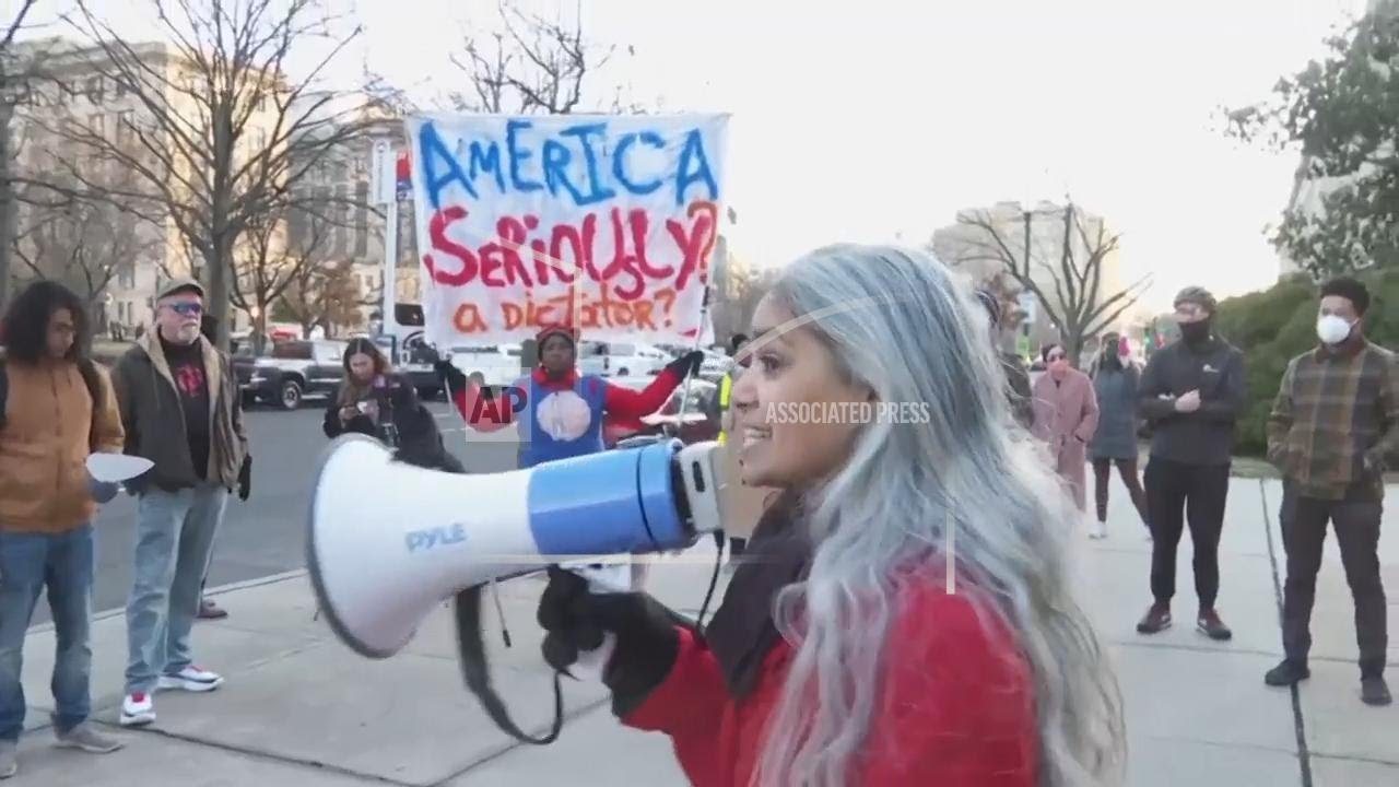 People protesting Elon Musk and DOGE gather outside the Office of Personnel Management