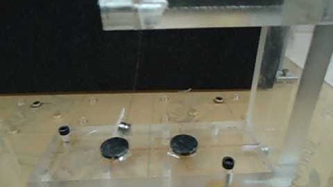 Chaotic oscillations in bistable magneto-elastic oscillator