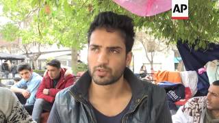 Migrants take shelter in central Athens square