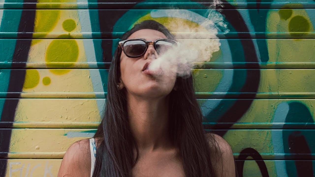 videos of women smoking cigarettes Woman cigarette while sitting on the boat and talking with someone Women Smoking Cigarette 4K &