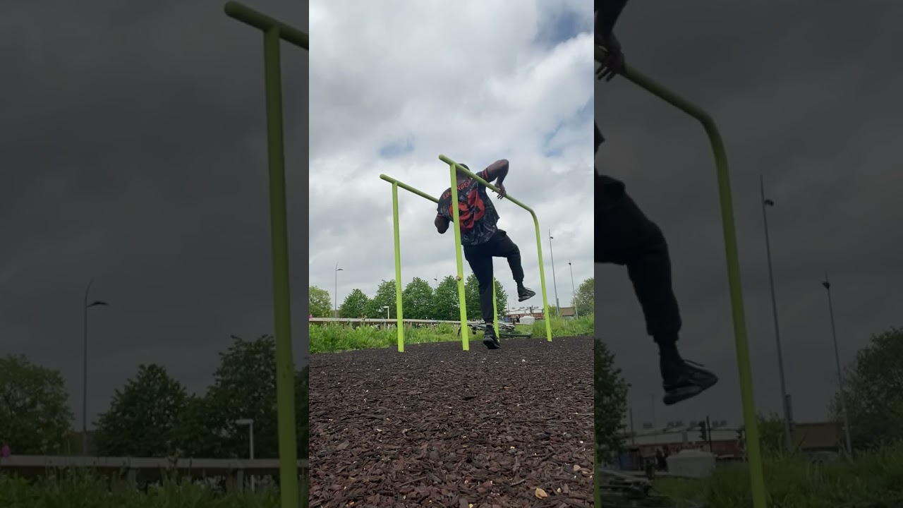 Guy exercising on bars at playground accidentally falls and hits sensitive area on green pole