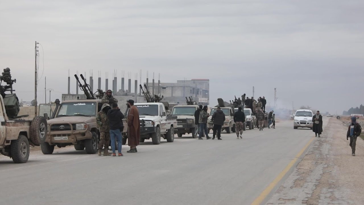 Syrian military vehicles prepare to enter Kurdish-held town east of Aleppo | AFP