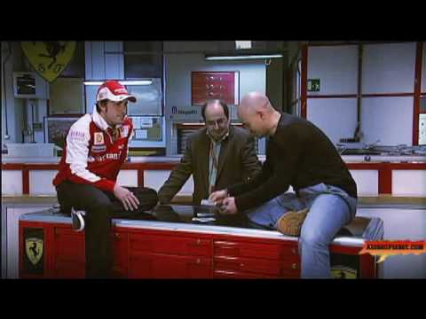 Fernando Alonso doing magic trick with cards for L...