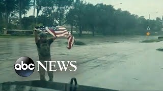 Police officer recovers American flag on Sept. 11 anniversary