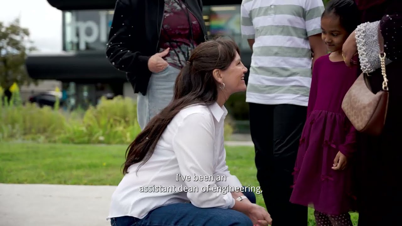 Marisa Sterling speaking with a family