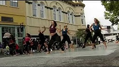 Dancers dancing a fusion of styles in the stsreet.