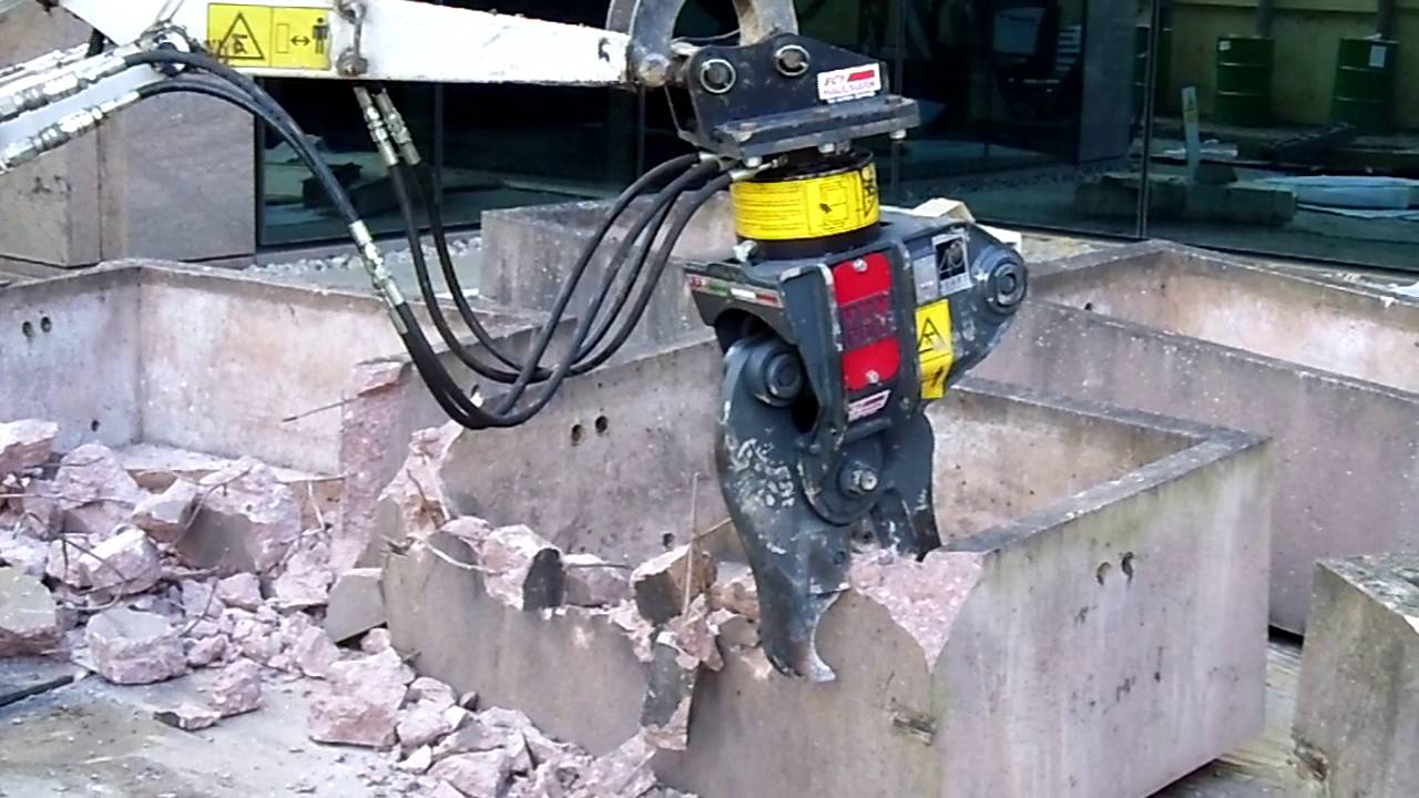 Bobcat with Concrete crusher attachment YouTube