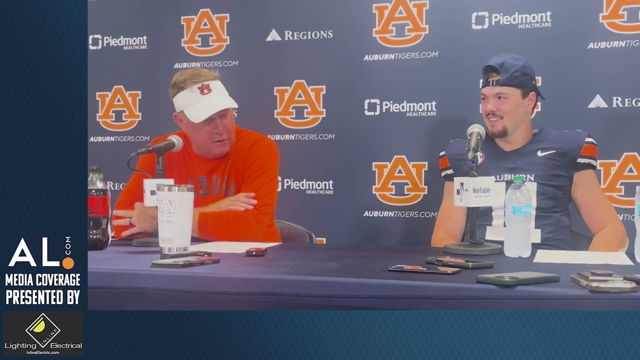 Hugh Freeze and Jackson Arnold address the media following