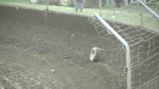 Stock Car Loses Tire On White Flag Lap