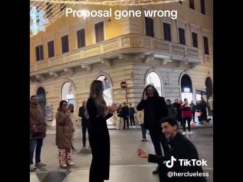 Boyfriend's romantic proposal in front of cheering crowd goes badly wrong when his unimpressed girlf