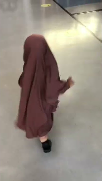 Little baby girl skipping in a pink Muslimah Kouture Jilbab!