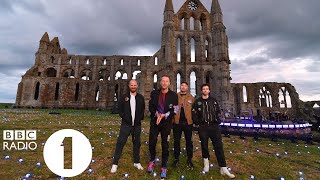 "I thought this was a secret!" Greg James talks to Coldplay at Whitby Abbey