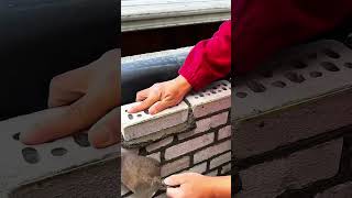 Placing Perforated Brick On Fresh Mortar Layer