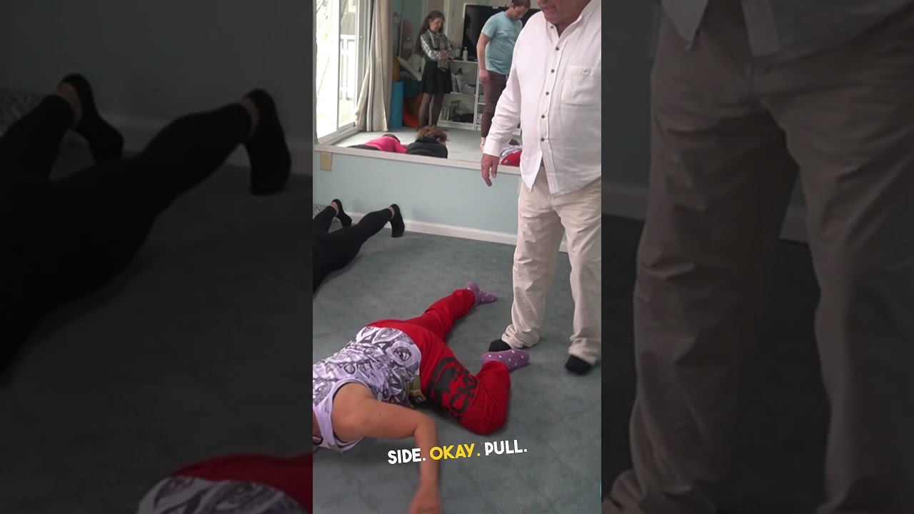 Meir shows Basic Training students the bending and stretching exercise  