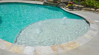 Stunning Kidney shape gunite with many water features