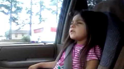 Bella dancing in the van.